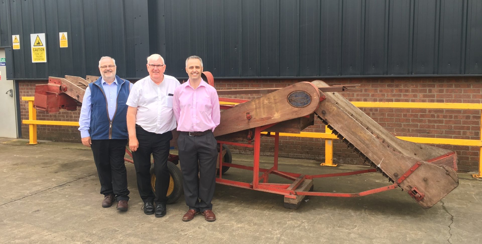 When you have been growing as a family business for over 85 years, four generations, and in your 'home' Lincolnshire market-town of Spilsby, I guess it's only natural that you have employees that have been with the company for many years? But 50 years of service with that same company, I'm sure you'll agree is certainly something to celebrate!? Yes, Brian Grant, who is now a highly experienced Production Engineer, is our longest ever serving member of team Tong. Whilst he's not alone when it comes to the 'long-service' stakes, as we are very proud to have many employees who have been at Tong for most, if not all of their working life, Brian joined the company back in 1967 (before some of us were even born!). There's one thing for sure, the fact that Brian lives just a short walk from Tong HQ means the commute to work has never really been too gruelling! But it's the fact that Tong has been a "good sound company to work for" that's kept Brian coming back for more every working day for the last 50 years! And when we say there's one thing for sure, there actually is something else for sure... Brian has seen some significant changes not only in the company, but more noticeably in the evolvement of Tong's handling equipment over those 50 years... When Brian started, back in 1967, our current Managing Director's grandfather, Ken Tong, was running the company, overseeing the business' growth in manufacturing sorting equipment for farmer's and growers across the UK. The well-known Tong sorter was an essential piece of kit on hundreds, in fact , thousands of farms, and our old hand-written order books show we were selling, and producing handfuls of these sorters per day. A snapshot back in the day during 1967, shows that 132 sorters were sold in just 3 months. "Back then," says Brian, "our skills were more centred around joinery. We knew those sorters like the back of our hand and the orders just kept coming in! Now we are producing today's equivalent, our Caretaker mobile grader, which not only dwarfs the old Tong sorters in size, but the engineering and technology that these machines are now built upon is phenomenal." Fast forward 50 years, and having worked with all four generations of the Tong family; Edmund, Ken, Charles and Edward, there is very rarely a question that anyone has for Brian that he can't answer. Charles Tong, now Chairman at Tong Engineering says "We didn't have computers for a very long time after Brian started working for the company, but after a few years we had felt like we had a 'hard drive' which stored important information.... which could be found in Brian's head! The specific details and information on our machines, that Brian has stored over the years is unimaginable;  we still test his knowledge today and he never lets us down. " Brian is the first to say how things have moved on somewhat over the 50 years of being with Tong; "The company has changed beyond recognition from my early days. We all get bad days, but 50 years says it’s a good sound company to work for, and I always thought of Ken and Joan (Mr & Mrs Tong) as friends as well as my employer," says Brian. "Joan took care of me when I first moved from the shop floor into the offices and made it like home;  Ken reassured me of my job and was always there for me if I was struggling. His guidance has passed onto Charles and Edward, and it shows; with continued sound guidance I am sure the company will continue to grow through the next generations," added Brian. "I still very much enjoy my job at Tong Engineering, and here's to many more years... I don't have any immediate plans to put my feet up yet!" Speaking of Brian's achievement, Edward Tong, Managing Director said "It's quite strange to think that Brian was actually working for the family business before I was born!" "He has displayed so much experience and knowledge over the years, and his role with the company is highly valued. I think it's fair to say that whilst our workforce is continuously expanding and developing, with fresh blood bringing new ideas across all departments of the business, having so many long-standing members of the team has certainly helped us to maintain a very personal, friendly and family-run culture. Our employee's commitment to the business has been vital to our growth and development over the years, and we're very proud that their ongoing commitment has been key to us building very valuable, long-term relationships with our customers." So, not only has Brian's loyalty to Tong Engineering seen him witness some huge changes in the agricultural and vegetable industries over the years, it also suggests that team Tong is a pretty good team to be part of?! Of course, such an anniversary could not go unnoticed, but being not one for 'fuss', we managed to twist Brian's arm into allowing us to hold a celebratory BBQ on the very day he started his career with Tong all those 50 years ago. If there's one thing that brings everyone together it's a good catch-up with good food; and that's just what it was... freshly cooked Lincolnshire produce in the Tong factory yard, with a few old faces in the mix for old time's sake! It was a great opportunity for us to get some of our old kit on show, reminisce about the good old Tong days and dare to imagine what the next 50 years may hold!